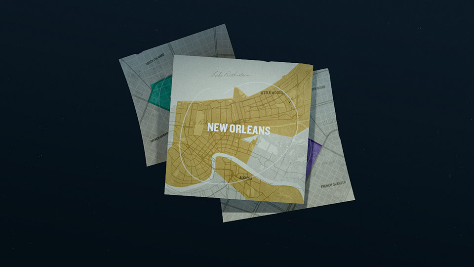 Layered New Orleans map cards scattered like loose paper