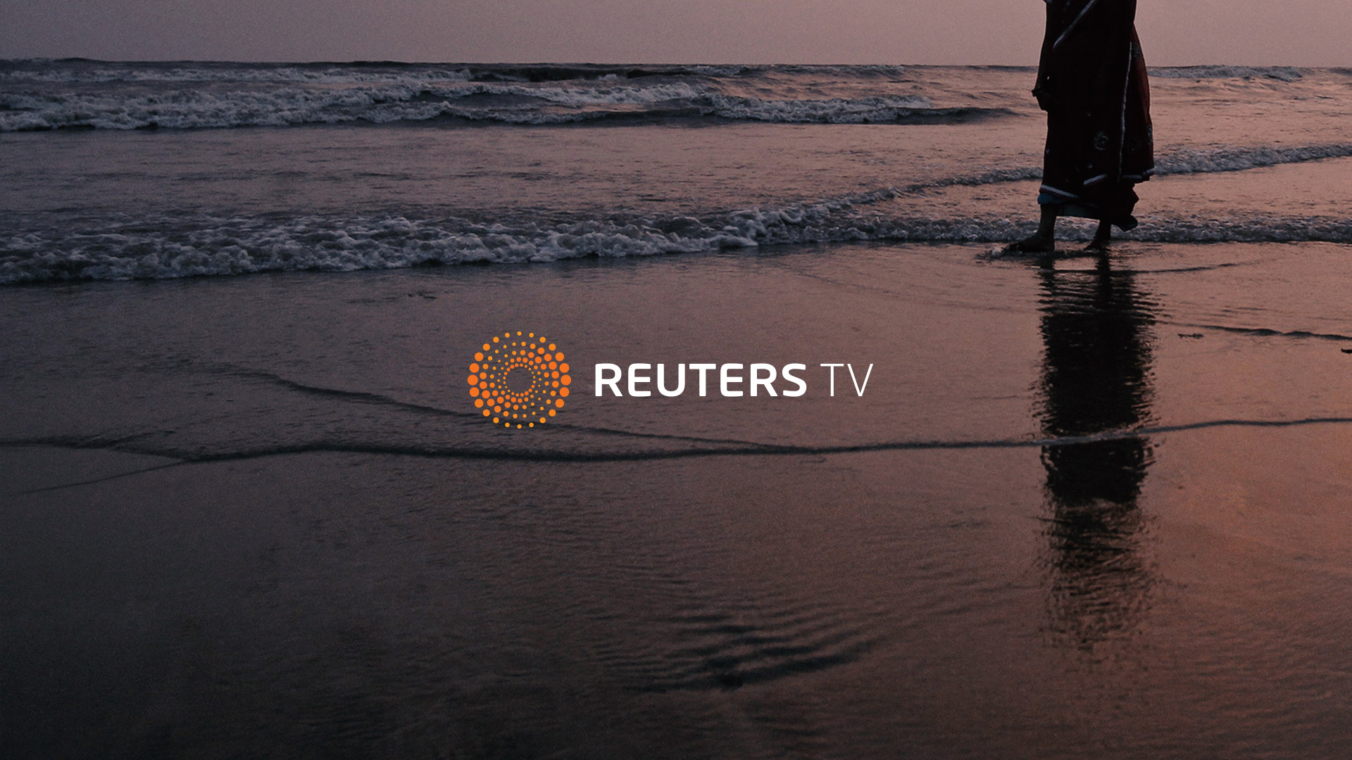 Reuters TV logo card over a shoreline at dusk
