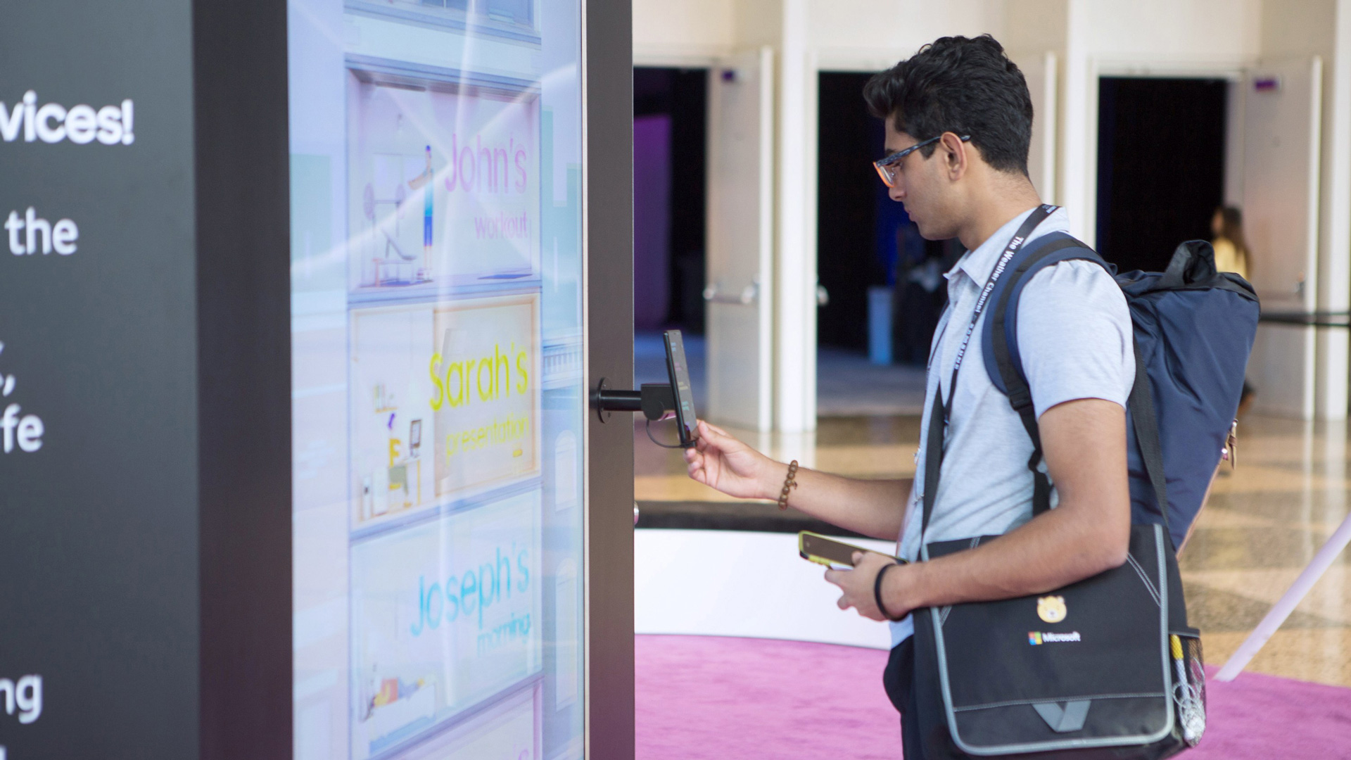 Attendee using a handheld controller to select a card on the wall