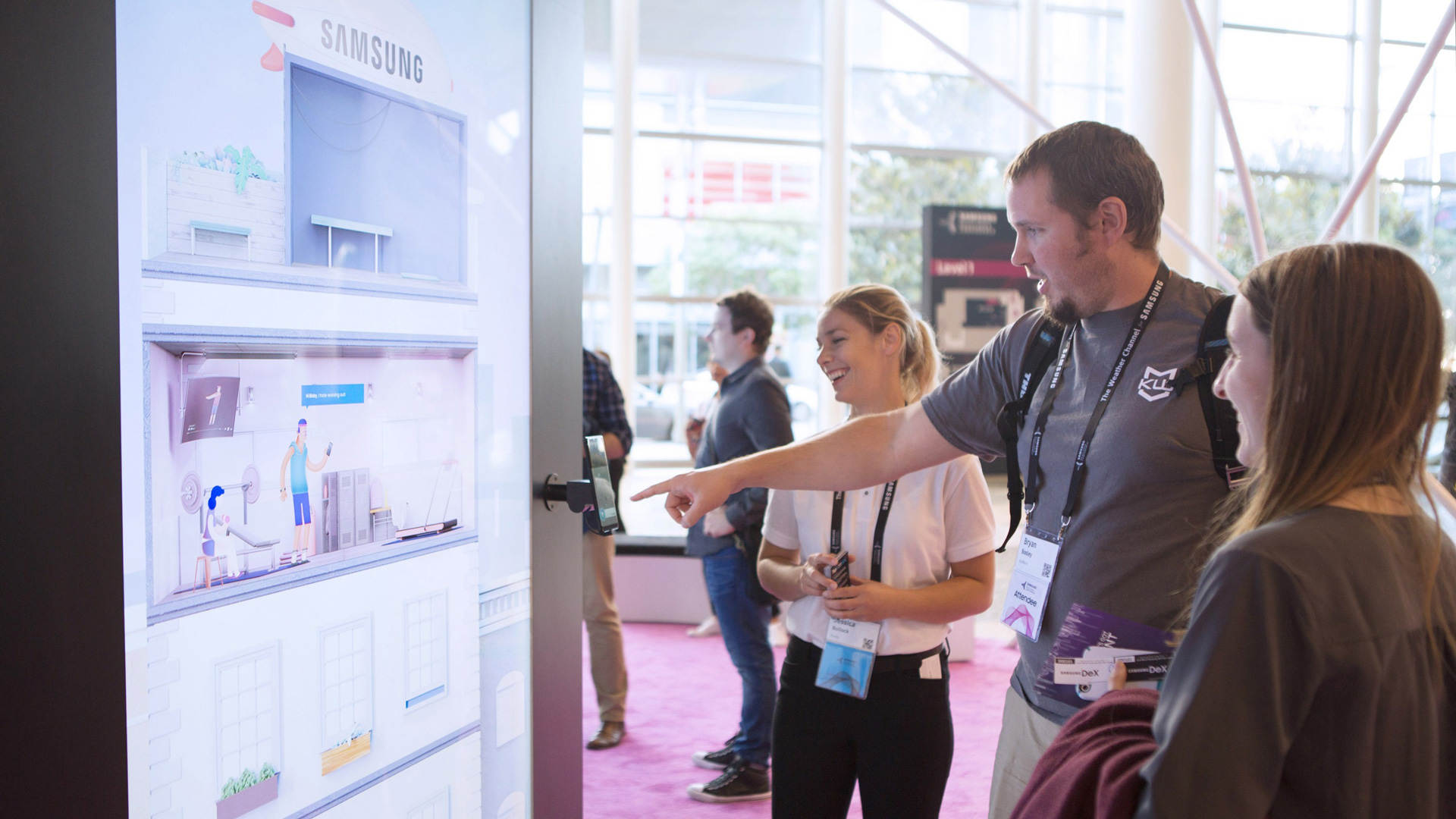 Attendees watching a smart home scene play out on the Samsung wall